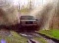 1993 GMC Yukon demolishing a mud pit