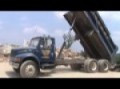 International Dump Truck Dumping Asphalt