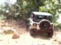 Jeep TJ climbs a short ledge