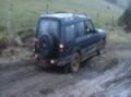 Meggy driving our Landrover through some mud