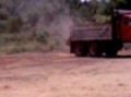 Sterling dump truck dumping brush