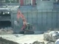 fiat-hitachi fills a tub of cement